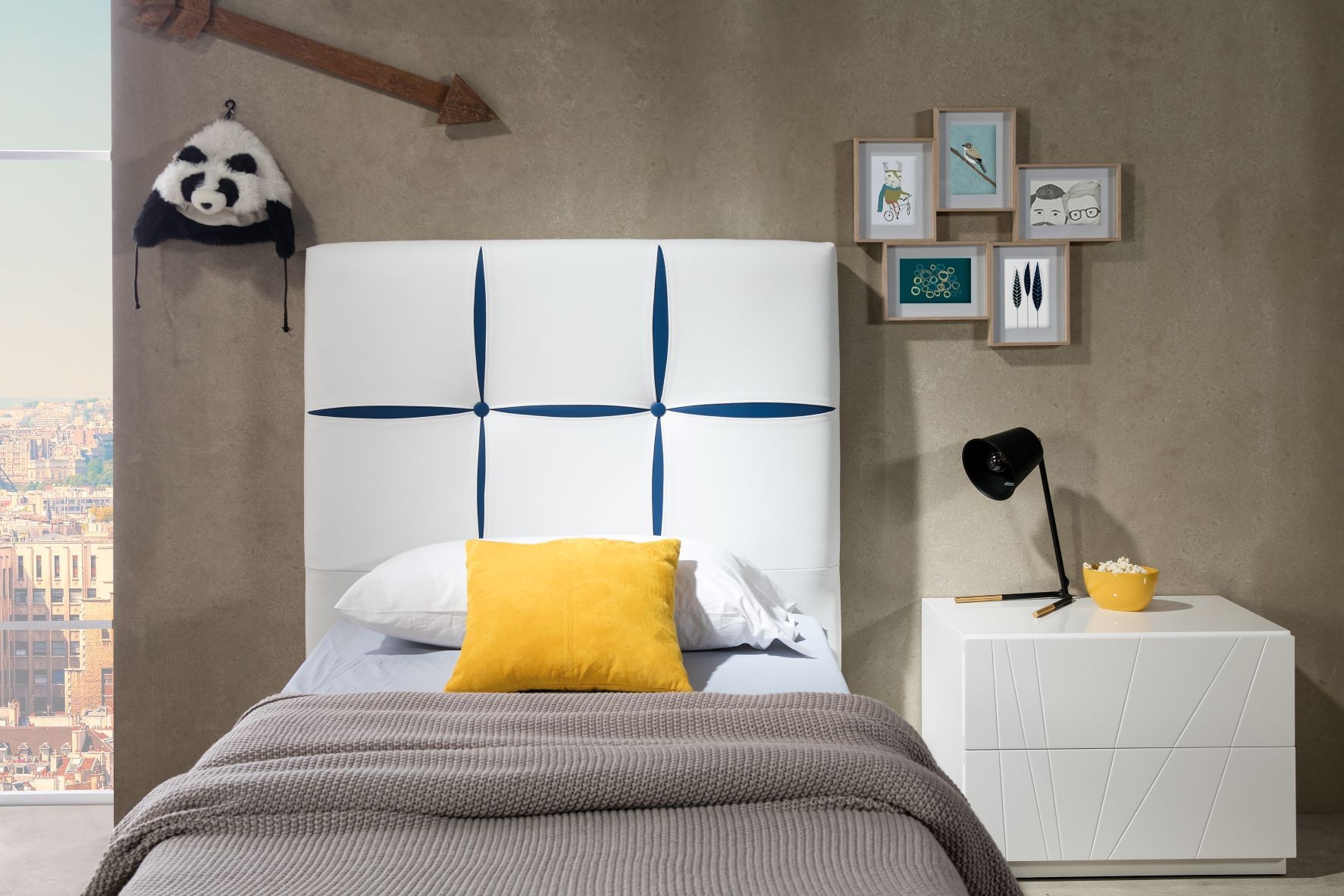 Estila Dizajnová kožená jednolôžková posteľ Veronica so vzorovaným čelom bielej farby 90-105cm