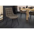 Dizajnová industriálna jedálenská stolička Moritz s prešívaným čalúnením v sivom odtieni taupe a čiernymi kovovými nohami 51 cm
