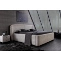 Dizajnov&aacute; art deco manželsk&aacute; posteľ Lanc v sivom poťahu z bukl&eacute; s &uacute;ložn&yacute;m priestorom a v&yacute;klopn&yacute;m ro&scaron;tom 180 cm
