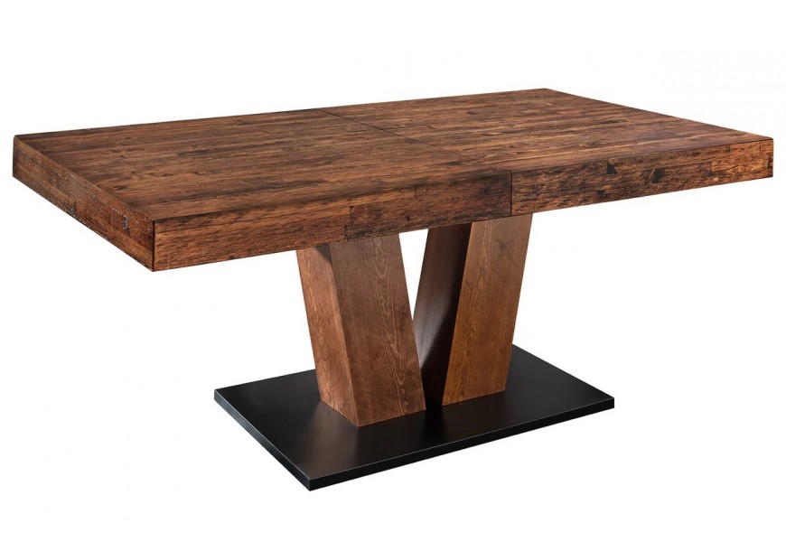 Masívny moderný obdĺžnikový jedálenský stôl Sawyer z dreva v tmavej hnedej farbe s rustikálnou patinovanou povrchovou úpravou s rozkladacou doskou s dvomi mohutnými zošikmenými nohami na obdĺžnikovej podstave v čiernej farbe