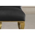 Dizajnov&aacute; glamour jed&aacute;lensk&aacute; stolička Gold Barock s kabriolov&yacute;mi nožičkami v zlatej farbe a čiernym zamatov&yacute;m poťahom 105 cm