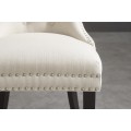 Z&aacute;mock&aacute; jed&aacute;lensk&aacute; stolička Torino v bielej farbe s chesterfield pre&scaron;&iacute;van&iacute;m a strieborn&yacute;mi nitmi s čiernymi nožičkami 93 cm