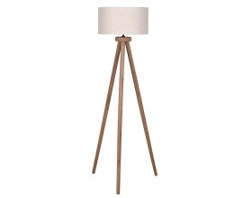 Mas&iacute;vna vidiecka stojaca lampa Ira s tromi nožičkami z mangov&eacute;ho dreva v hnedej farbe s valcov&yacute;m okr&uacute;hlym tienidlom z bavlny v b&eacute;žovej farbe