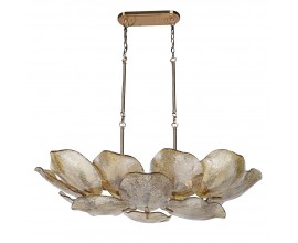 Luxusn&yacute; glamour luster zo skla a zlat&eacute;ho kovu s organick&yacute;m listov&yacute;m dizajnom s &scaron;trukt&uacute;rovan&yacute;m sklenen&yacute;m tienidlom s kovov&yacute;mi spojmi a z&aacute;kladňou