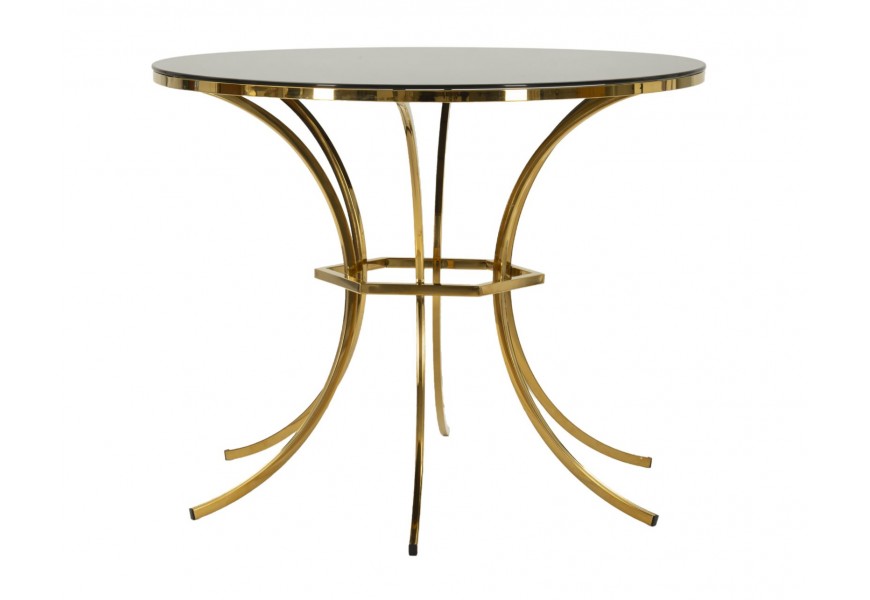 Dizajnový art deco sklenený jedálenský stôl Hailey s okrúhlou čiernou lesklou vrchnou doskou a kovovou podstavou so šiestimi nohami prehnutými do poloblúka so šesťuholníkovou spojnicou v zlatej farbe