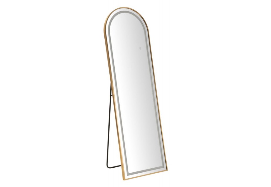 Art deco zlaté obloukové zrcadlo Leanor se stojanem a kovovým rámem s LED osvětlením na skleněné ploše
