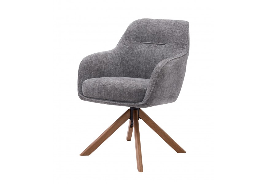 Moderné otočné sivé jedálenské kreslo Egon s opierkami na ruky s poťahom so zamatovým leskom so šikmými dubovými nohami v prírodnej svetlej hnedej farbe