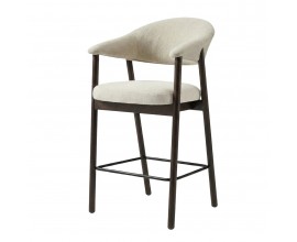 &Scaron;kandin&aacute;vska barov&aacute; stolička Bodil so ženilkov&yacute;m poťahom v kr&eacute;movo bielej farbe na sedadle a opierke s dreven&yacute;m r&aacute;mom v pr&iacute;rodnom dubovom tmavom hnedom preveden&iacute; s priznanou kresbou letokruhov