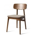 Škandinávska severská jedálenská stolička Vimo s masívnou dubovou konštrukciou v tmavej hnedej farbe s priznanou kresbou letokruhov so sedadlom s čalúnením a poťahom z buklé v melírovanom bielo-béžovom prevedení