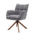 Moderné otočné jedálenské kreslo Laerke s opierkami na ruky s čalúnenou sedacou časťou so ženilkovým poťahom v sivej farbe s lineárnym prešívaním na opierke so štyrmi šikmými nohami z masívneho dubového dreva v prírodnom hnedom prevední