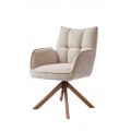 Moderné škandinávske jedálenské kreslo Laerke s otočnou čalúnenou sedacou časťou so ženilkovým poťahom v béžovom ľanovom odtieni s prešívaním s obdĺžnikovým vzorom s opierkami na ruky s podstavou so štyrmi šikmými nohami v prírodnom hnedom dubovom prevedení