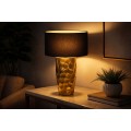 Luxusn&aacute; art-deco stoln&aacute; lampa Almina so zlat&yacute;m hlin&iacute;kov&yacute;m podstavcom s kladivkov&yacute;m efektom a čiernym textiln&yacute;m tienidlom 53 cm 