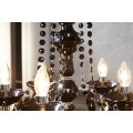 Dizajnový zámocký luster Karat v čiernej lesklej farbe s pätnástimi ramenami s dekoratívnymi kryštálmi 80 cm