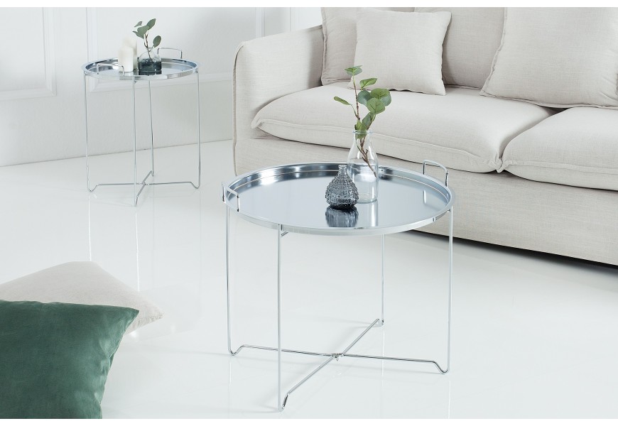 Jednoduchý kovový stolík okrúhleho tvaru do moderných priestorov