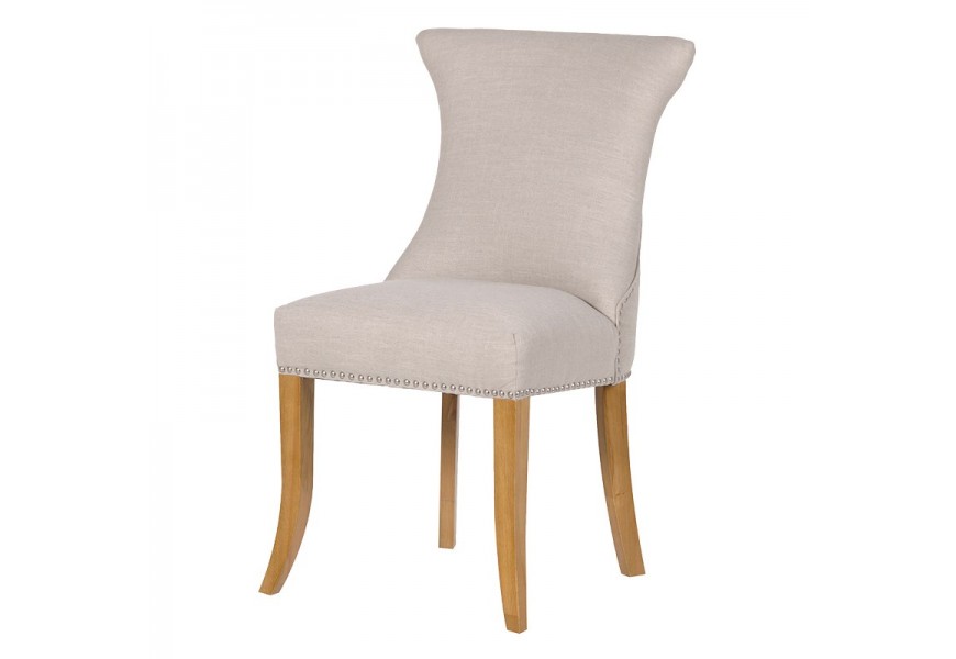 Dizajnová jedálenská stolička Ondine v slonovinovom prevedení s kovovým klopadlom na operadle a masívnymi nohami