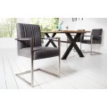 Dizajnová stolička Inspirativo v retro štýle so sivým poťahom z mikrovlákna a s kovovou konštrukciou striebornej farby
