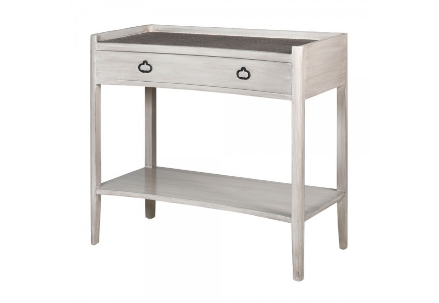 Vintage konzolový stolík Celene IV v bielych provensálskych odtieňoch masívneho dreva je doplnený kovovými úchytmi na zásuvke a