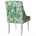 Moderná jedálenská stolička Tica so zeleným forálnym vzorom  a priehľadnými nohami 103cm