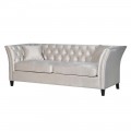 Chesterfield sedačka s prešívaním na lesklom zamatovom požahu v odtieňoch bielej doplnená čiernymi masívnymi nohami
