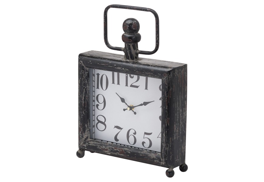 Štýlové retro hodiny na guľatých nožičkách štvorcového tvaru v čiernej farbe s dizajnovým ciferníkom