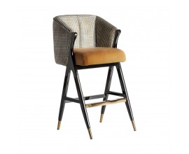 Štýlová čalúnená horčicová Art-deco barová stolička Brilon s čiernou konštrukciou z dreva a zlatými prvkami