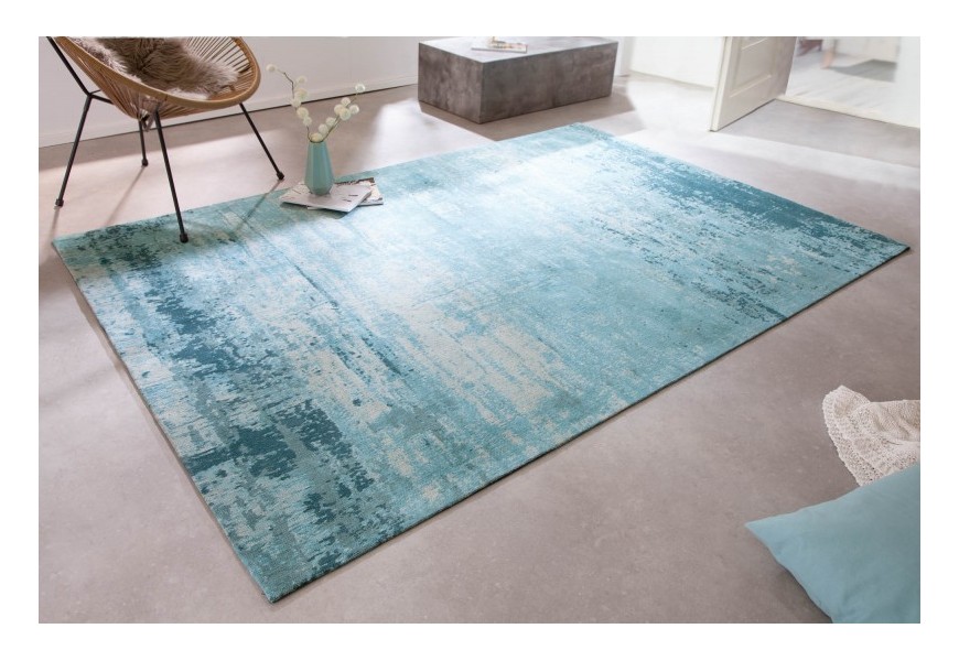 Štýlový bavlnený obdĺžnikový koberec Vernon v tyrkysovej farbe s vypraným efektom