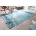 Štýlový bavlnený obdĺžnikový koberec Vernon v tyrkysovej farbe s vypraným efektom