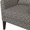Retro čierno-biele vzorované kreslo Xolotl s čiernymi drevenými nožičkami 110cm