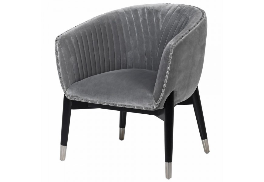 Art-deco štýlová stolička Bresta v sivom zamatovom prevedení s čiernymi kovovými nohami