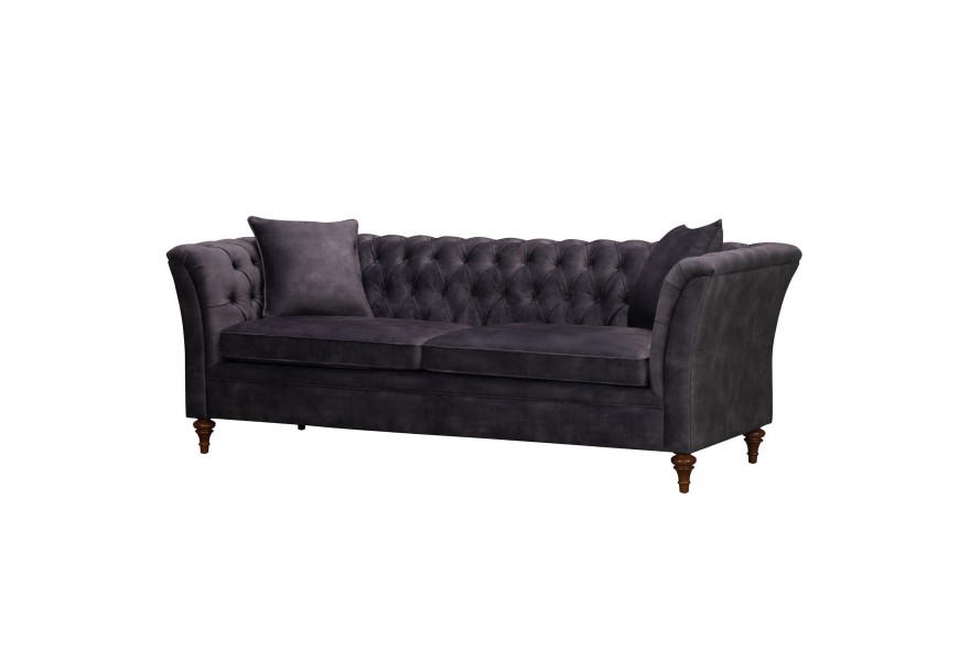Dizajnová pohovka Preyta s tmavo sivým Chesterfield prešívaním na chrbtovej opierke s hnedými nožičkami