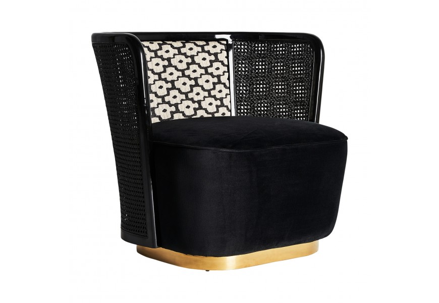 Art-deco kreslo Brilon s čierno bielym vzorovan&yacute;m zamatov&yacute;m čal&uacute;nen&iacute;m s ratanov&yacute;mi opierkami a zlatou podstavou 83cm