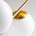 Art-deco luxusné závesé svietidlo Esme so zlatou geometrickou konštrukciou z kovu so štyrmi bielymi tienidlami zo skla 119cm