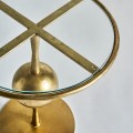 Art-deco dizajnový okrúhly príručný stolík Terrie do obývačky z kovu v zlatej farbe so sklenenou povrchovou doskou 46cm