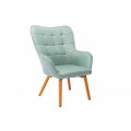 Štýlové moderné kreslo Scandinavia s prešívaným operadlom s tyrkysovým čalúnením a s hnedými drevenými nožičkami