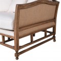 Štylová masívna lavica Barbadosa z hnedého dreva s čalúnením v slonovinovej farbe s podsedákom a vankúšmi