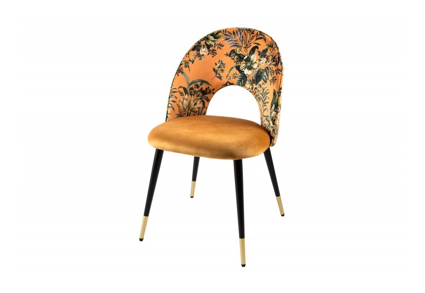 Čalúnená vzorovaná art deco stolička Floreque v žlto-zlatej farbe s čiernou kovovou konštrukciou a opierkou oválneho tvaru