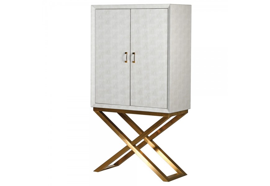 Art deco moderná barová skrinka Ivoria s vnútorným úložným priestorom, zásuvkami a dvierkami v sivom koženom čalúnení na prekrížených zlatých nožičkách