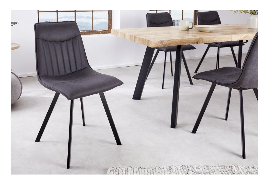 Dizajnová industriálna stolička Aston s tmavosivým prešívaným čalúnením a s čiernymi nohami z kovu