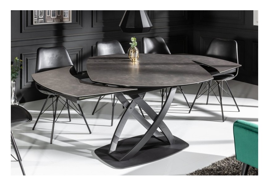 Moderný industriálny jedálenský stôl Lutz v prekríženými kovovými čiernymi nožičkami a antracitovou sivou vrchnou oválnou rozkladacou doskou