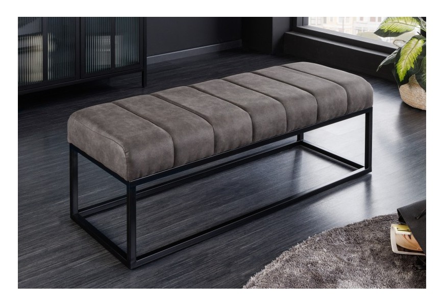 Moderná taburetka Petia v industriálnom sivom prevedení s čalúnením zo zamatu a kovovou konštrukciou v čiernej farbe