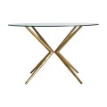 art deco jedálenský stôl sursee s prekríženými nožičkami a sklenenou okrúhlou doskou
