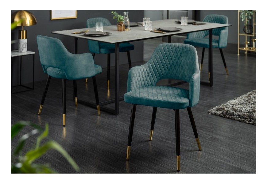 Dizajnová jedálenská stolička Decora s petrolejovo modrým zamatovým čalúnením a kovovými nožičkami so zlatým zakončením