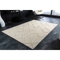 Elegantný obdĺžnikový koberec Monami s vlneným povrchom slonovinovej farby s jemným geometrickým vzorom