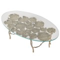 Dizajnový jedálenský stôl Lilypad so zlatou kovovou konštrukciou v tvare lekien a s oválnou sklenenou doskou