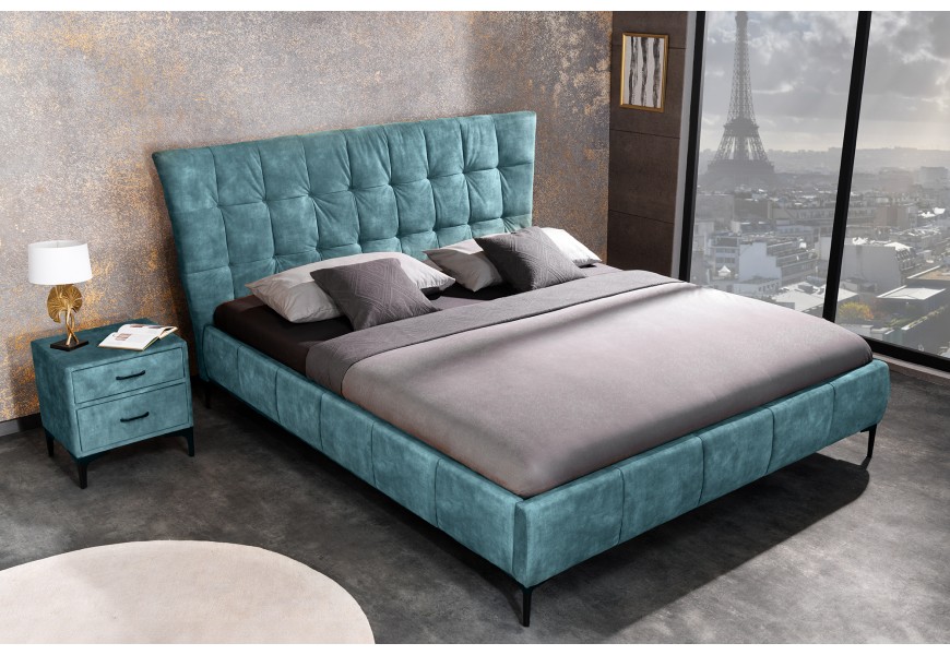 Štýlová chesterfield manželská posteľ Velouria modrej farby s prešívaným čelom a nožičkami z kovu