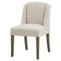 Luxusná moderná jedálenská stolička Lucia s poťahom z buklé látky v bielej farbe a s drevenými nožičkami 52 cm