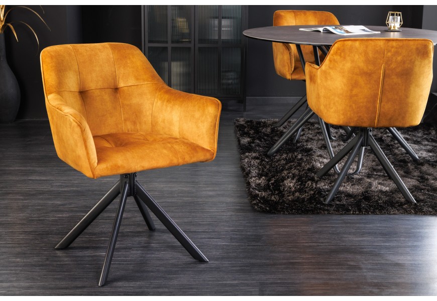 Dizajnová otočná stolička Devon so zamatovým poťahom okrovej farby a čiernymi kovovými nohami