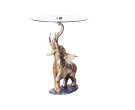 Dizajnový art deco okrúhly príručný stolík Balarama s podstavou v tvare slona v zlatej farbe na oválnom mramorovom podstavci s vrchnou doskou z bezpečnostného skla