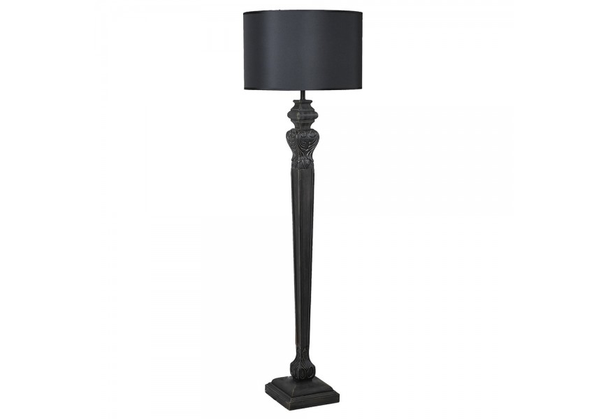 Dizajnová vintage čierna stojaca lampa Samir s oválnym textilným tienidlom a vyrezávanou vysokou úzkou nohou s vyrezávaným motívom anjelských krídiel