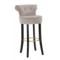 Dizajnová glamour okrúhla barová stolička Vivienne so sivým semišovým poťahom so zlatým lemovaním s dekoratívnymi gombíkmi v zámockom štýle s čiernymi hranatými nožičkami s kovovou okrúhlou opierkou na nohy v zlatej farbe